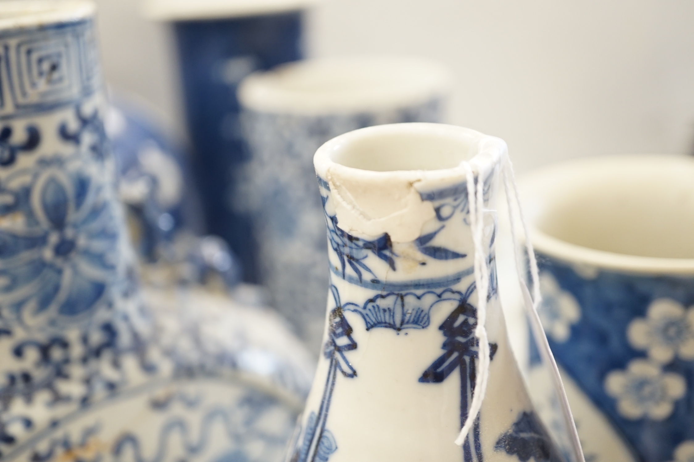 A Chinese blue and white Buddhist lion moon flask, a baluster vase, three sleeve vases and two others, 19th century, tallest 33cms (a.f.)